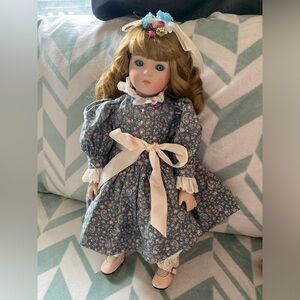 Porcelain Collectible Girl Doll in Blue Floral Dress with Pink Accents